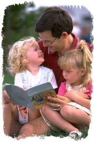 father reading to kids